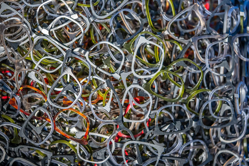 A dense mass of acetate fronts in green, silver, orange and red, packed together.
