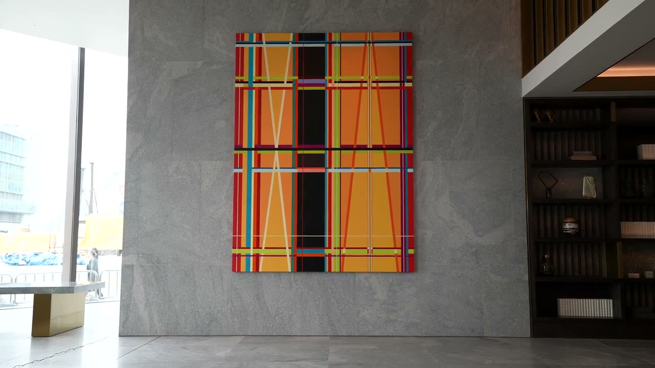 A finished geometric composition in woven colour.